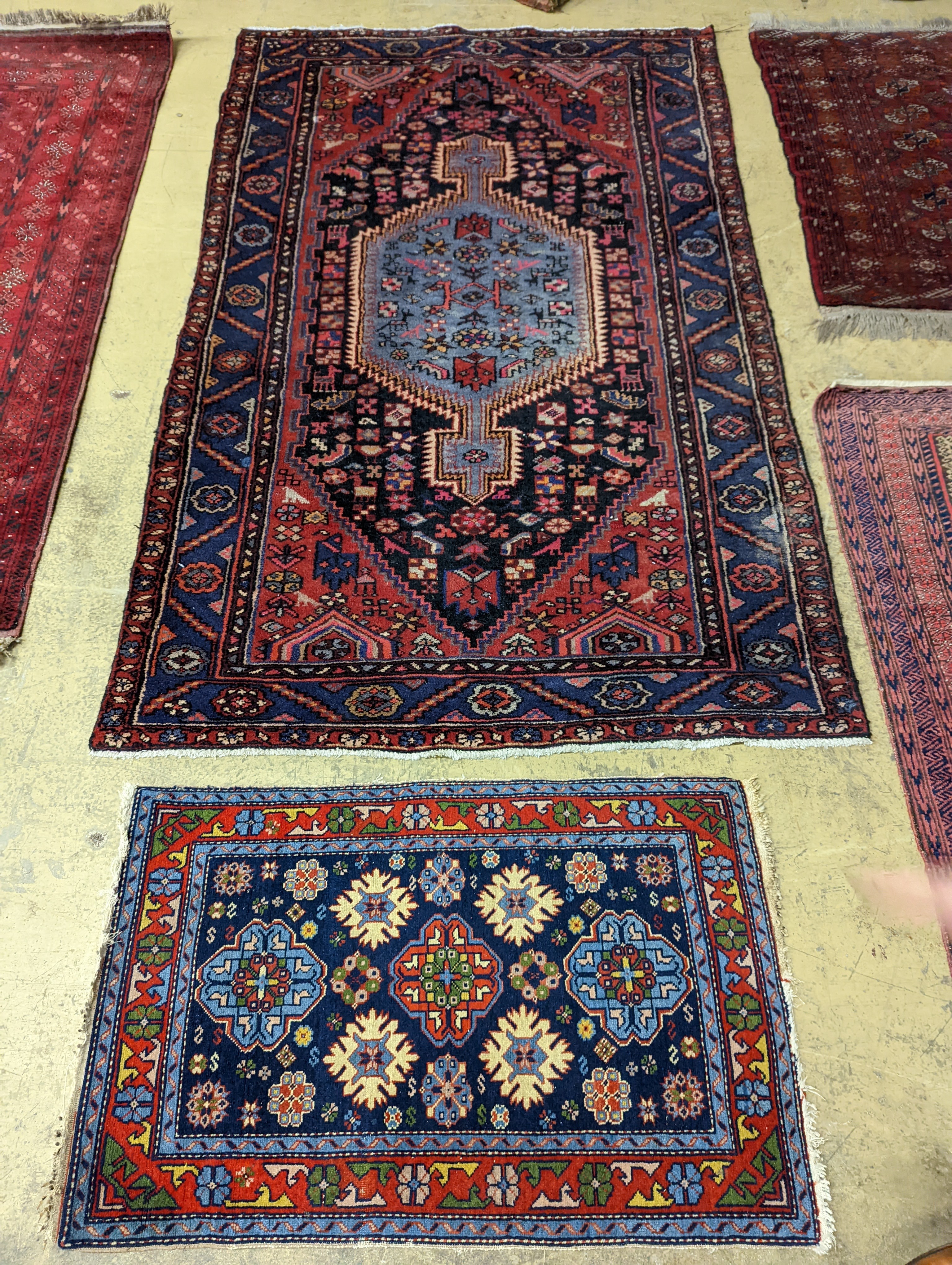 A Hamadan blue ground floral rug and a smaller Caucasian design blue ground rug, larger 210 x 130cm